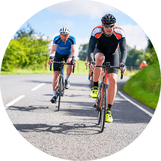 Cyclists riding on road